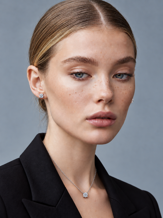 Mara wearing the silver Solène 1ct solitaire moissanite necklace with matching 1ct stud earrings