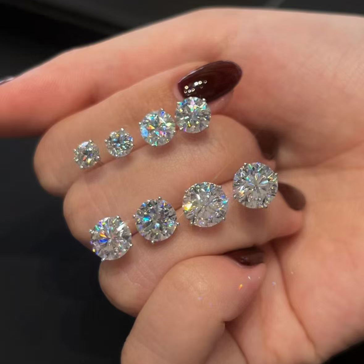 Solène Four-Claw Stud Earrings close-up of D colour VVS moissanite